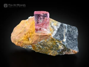 Pink topaz crystal on matrix from Katlang, Pakistan.