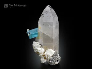 blue aquamarine crystal growing from clear quartz with albite and muscovite matrix