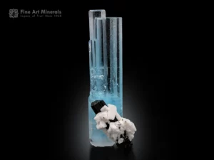 Beryl var. aquamarine crystal with black schorl and white albite showing strong contrast.