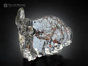 Hematite with red rutile inclusions and albite matrix