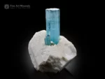 Sky blue aquamarine crystal with smaller crystals on matrix from Pakistan.