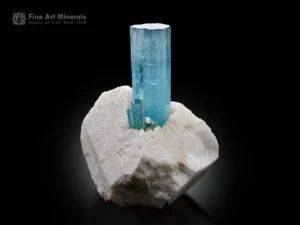 Sky blue aquamarine crystal with smaller crystals on matrix from Pakistan.