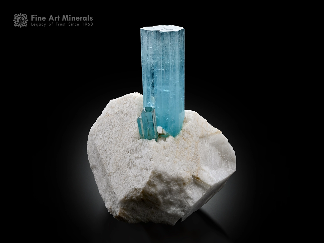 Sky blue aquamarine crystal with smaller crystals on matrix from Pakistan.