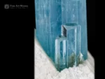 Sky blue aquamarine crystal with smaller crystals on matrix from Pakistan.