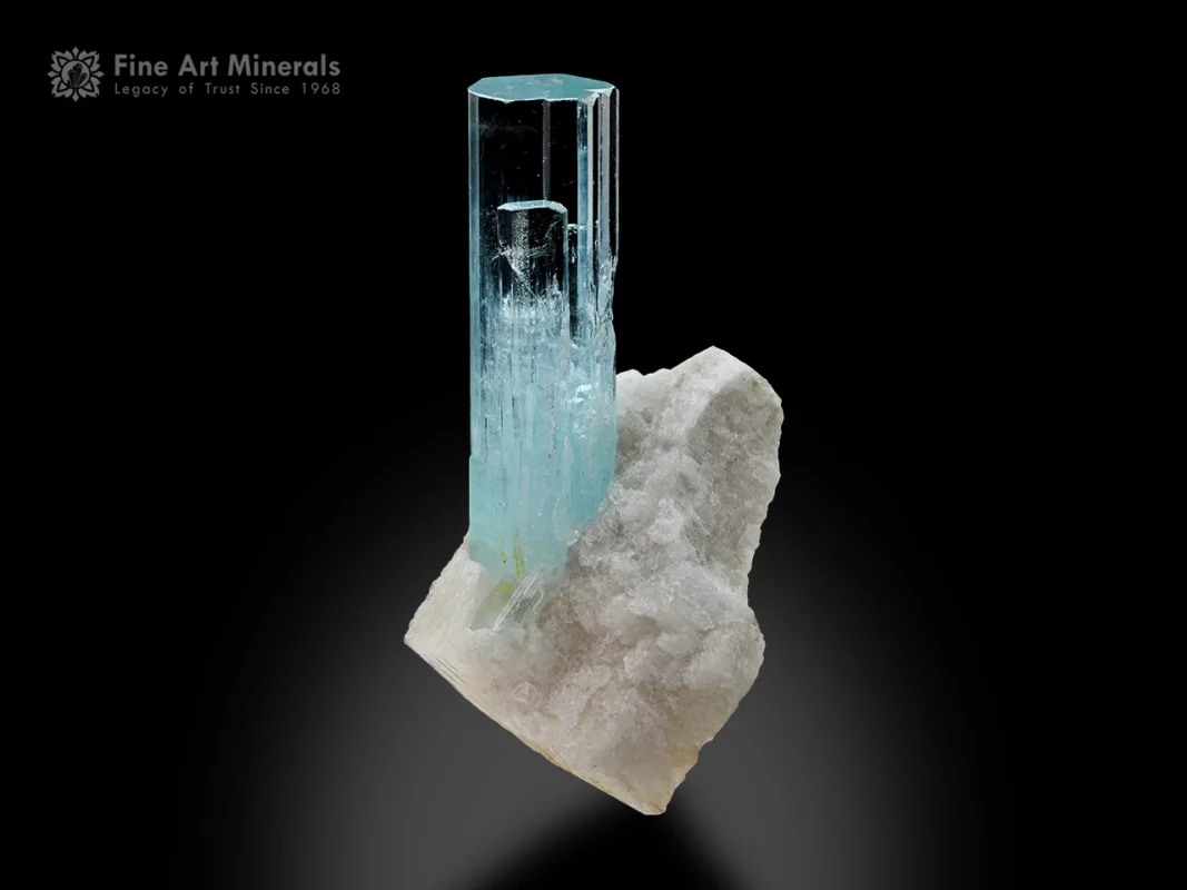 Aquamarine crystal on feldspar matrix with light blue color and sharp termination