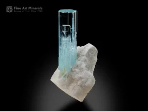 Aquamarine crystal on feldspar matrix with light blue color and sharp termination