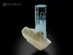 Aquamarine crystal on feldspar matrix with light blue color and sharp termination