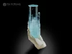 Aquamarine crystal on feldspar matrix with light blue color and sharp termination