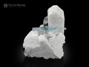 Aquamarine crystal on white feldspar with quartz and black schorl spray mineral specimen.