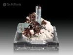 Sky blue aquamarine crystals with red garnet on matrix from Pakistan.