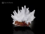 Translucent white aragonite crystal cluster on contrasting limonite matrix