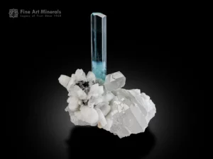 Gem-quality aquamarine crystal with hexagonal termination on sparkling quartz and albite matrix.