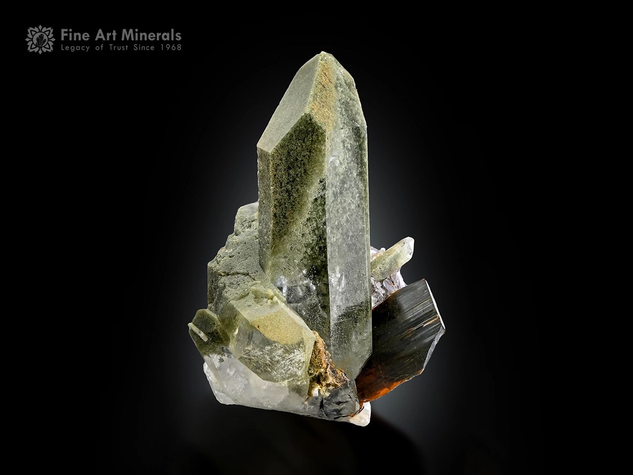 Brookite crystal associated with elongated chlorite-included quartz with sharp termination and natural contrast.
