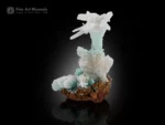 Calcite with chrysocolla on limonite mineral specimen with sculptural crystal formation and soft blue-green tones.