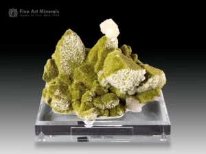 Green epidote specimen with moss-like texture and apophyllite crystal on top