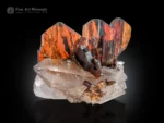 Vivid red Brookite crystal cluster on sparkling clear quartz matrix with strong contrast.