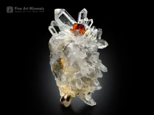 Fiery red brookite beautifully set on a sharp, lustrous quartz cluster.
