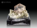 transparent bi colored fluorite crystal on muscovite and albite matrix from Nagar Valley, Pakistan.