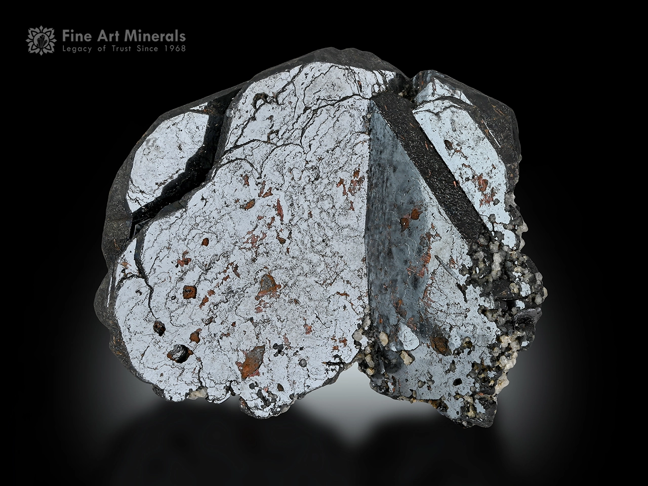 Hematite crystal cluster with mirror-like metallic luster and natural sculptural growth.