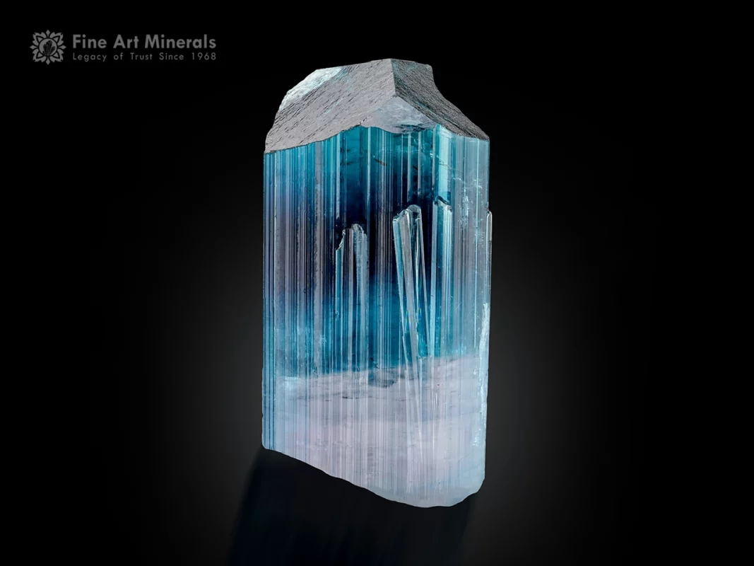 Indicolite tourmaline crystal with blue shades, purplish base, and fine vertical striations.