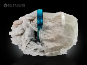 Blue indicolite tourmaline crystal with green zoning on quartz and cleavelandite matrix.