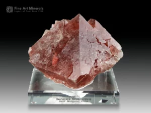Rose red octahedral fluorite crystal from Huanggang, China, with glowing translucency and floater formation.