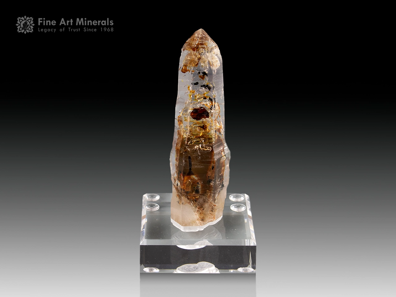 Clear quartz with golden petroleum inclusions and moving bubbles from Madagascar.