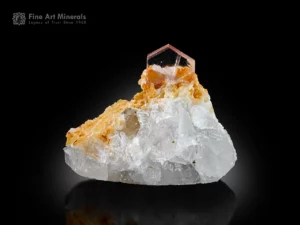 Pink apatite crystal on white calcite matrix with excellent clarity and geometry.