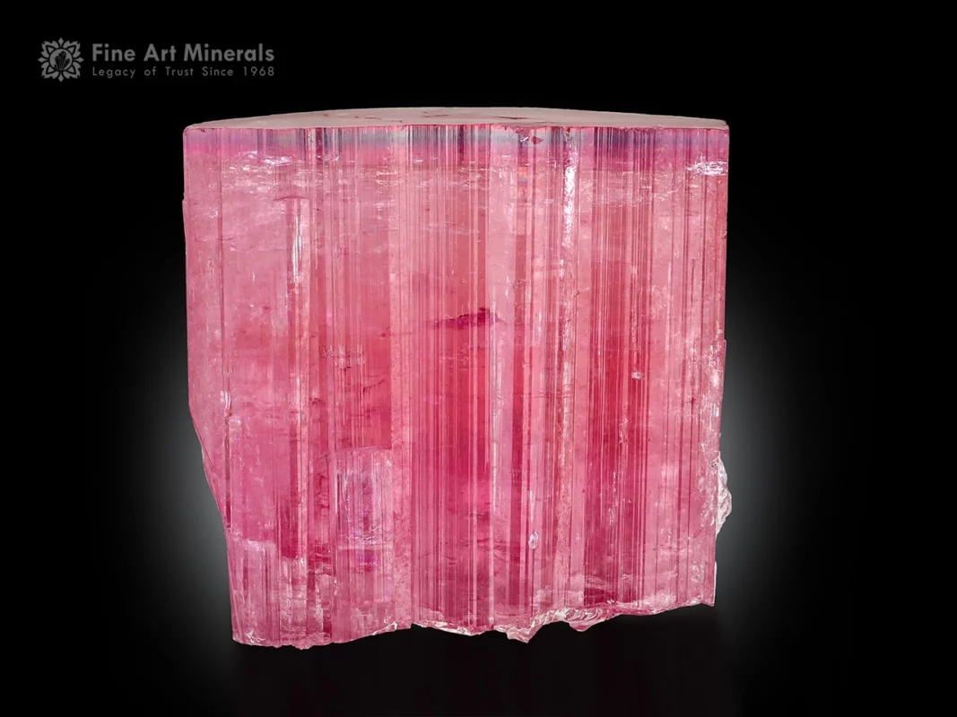 Pink tourmaline crystal with strong vertical striations and flat termination. t