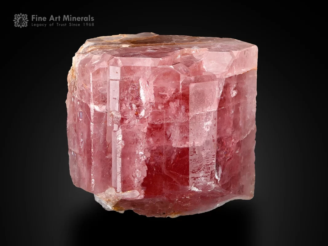 Pink apatite crystal with muscovite showing natural form and soft color from Pakistan.