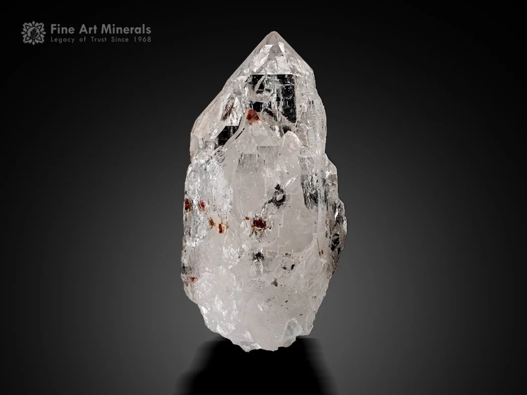 Quartz crystal with spessartine inclusions and sharp termination.