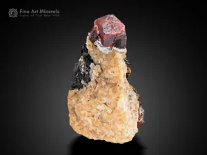 Red zircon crystal with sharp form on a contrasting natural matrix