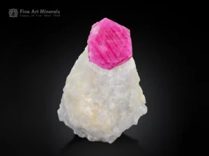 Ruby crystal on white matrix fluorescent under UV corundum specimen.