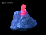 Ruby crystal on white matrix with pyrite fluorescent corundum specimen.