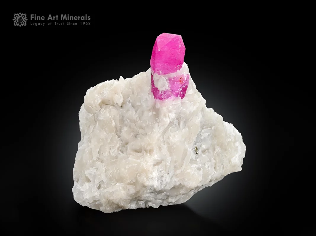 Ruby crystal on white matrix with pyrite fluorescent corundum specimen.
