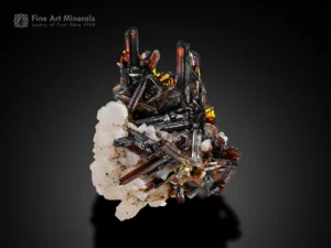 Rutile crystal cluster on albite matrix with red glow from Pakistan.