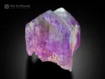 Lavender kunzite crystal with double growth and vertical striations showing a subtle green tint.