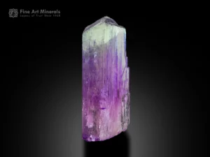 Lavender kunzite crystal with vertical striations and internal zoning.