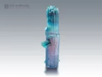 Tourmaline crystal with pink and blue-green color zoning and side crystals.
