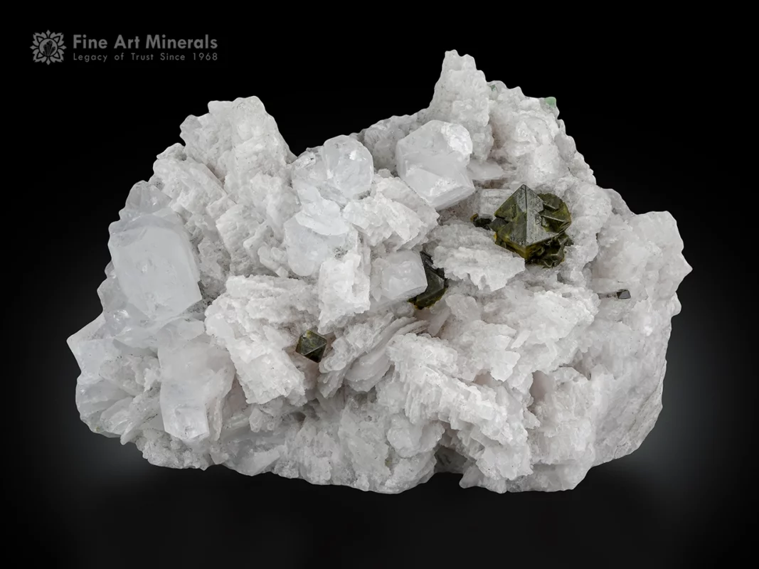Viitaniemiite crystals with a large microlite cluster on white albite matrix from Pakistan.