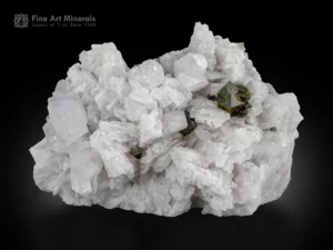 Viitaniemiite crystals with a large microlite cluster on white albite matrix from Pakistan.