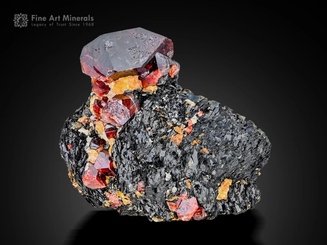 Zircon crystals on dark matrix, red color, waxy luster, and sharp geometry specimen.