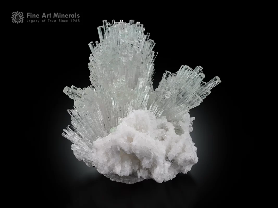 Radiating Achroite tourmaline crystal cluster on white albite matrix with superb transparency and luster.