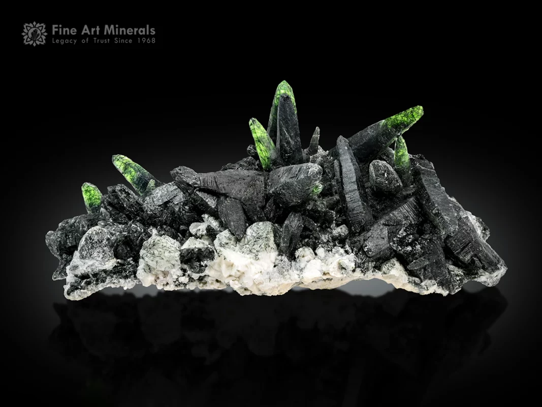 Quartz crystals with actinolite and chlorite inclusions showing green color under backlight on albite matrix.