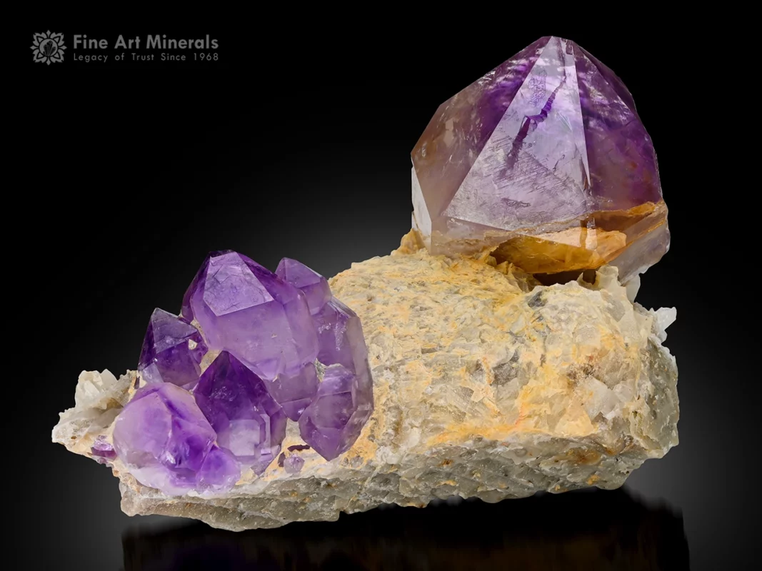 Fine purple Amethyst crystal cluster with glassy luster on a contrasting matrix.