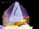 Fine purple Amethyst crystal cluster with glassy luster on a contrasting matrix.