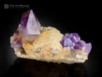 Fine purple Amethyst crystal cluster with glassy luster on a contrasting matrix.