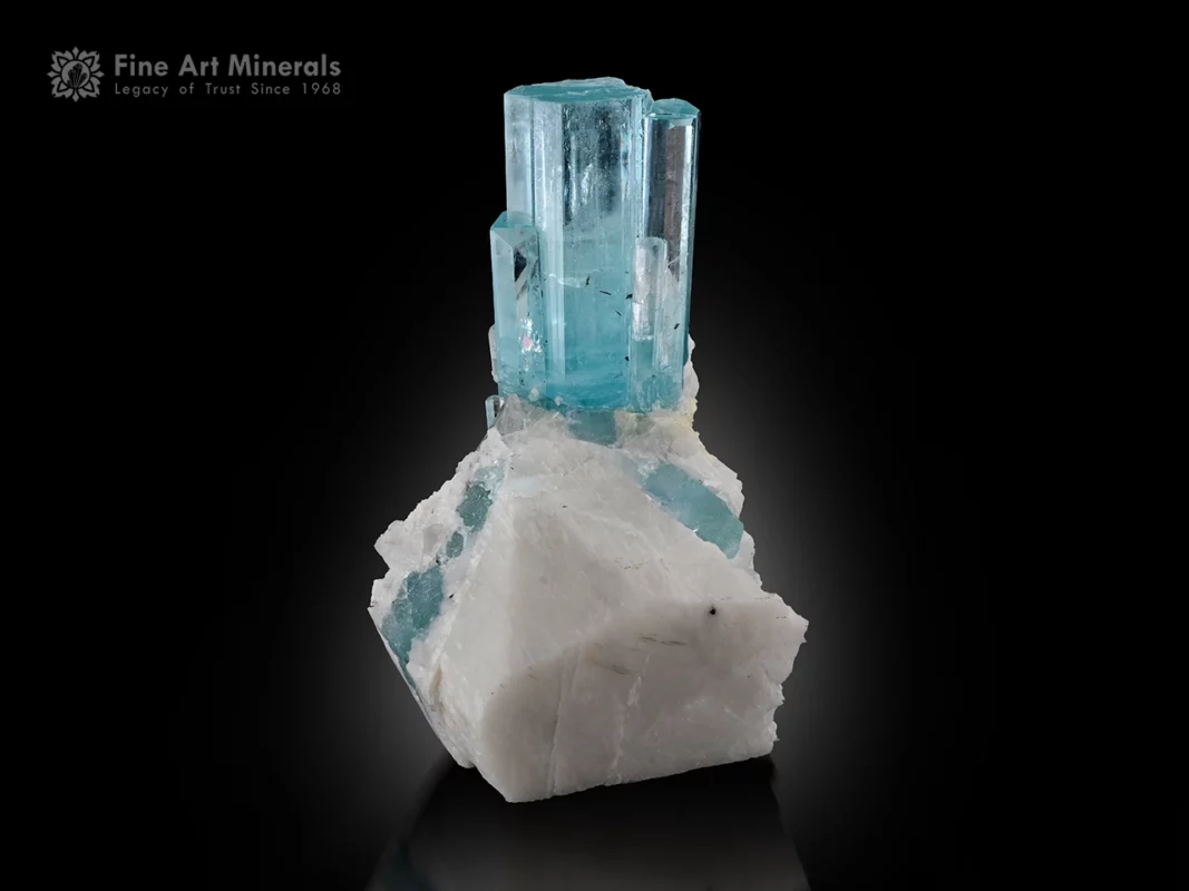 Blue aquamarine crystal cluster on white feldspar matrix from Pakistan.