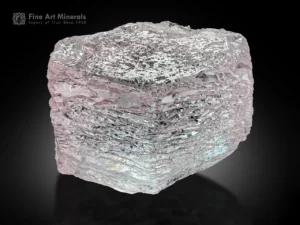 Pink morganite crystal with ideal hexagonal geometry and etched surface formations.