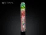 9 cm elongated bi-color tourmaline crystal with pink and green color zoning, doubly terminated, from Paprok Valley, Afghanistan.